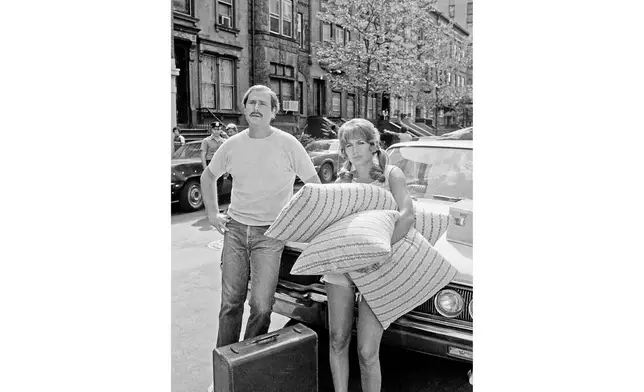 FILE - Actor Rob Reiner and his wife, Penny Marshall, waiting to begin a scene for the film "Love Me and I'll Be Your Best Friend," filming on New York's 84th Street, June 20, 1978. (AP Photo/Dan Grossi, File)