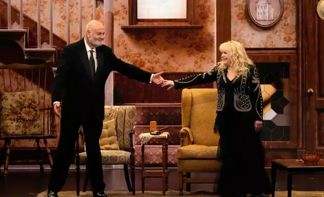 FILE - Rob Reiner, left, and Sally Struthers introducing the "In Memoriam" segment with a tribute to Norman Lear during the 75th Primetime Emmy Awards at the Peacock Theater, Jan. 15, 2024, in Los Angeles. (AP Photo/Chris Pizzello, File)