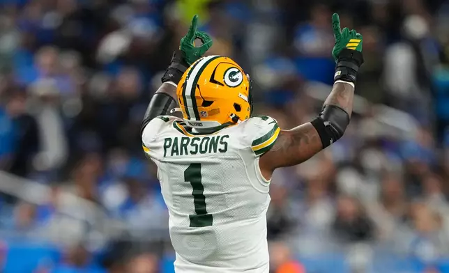 Green Bay Packers defensive lineman Micah Parsons (1) celebrates a sack against the Detroit Lions during the second half an NFL football game in Detroit, Thursday, Nov. 27, 2025. (AP Photo/Ryan Sun)