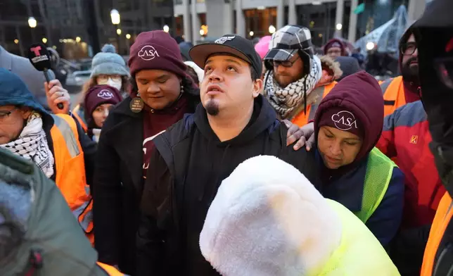 Kilmar Abrego Garcia waits to enter the building for a mandatory check at the Immigration and Customs Enforcement office in Baltimore, Friday, Dec. 12, 2025, after he was released from detention on Thursday under a judge's order. (AP Photo/Stephanie Scarbrough)