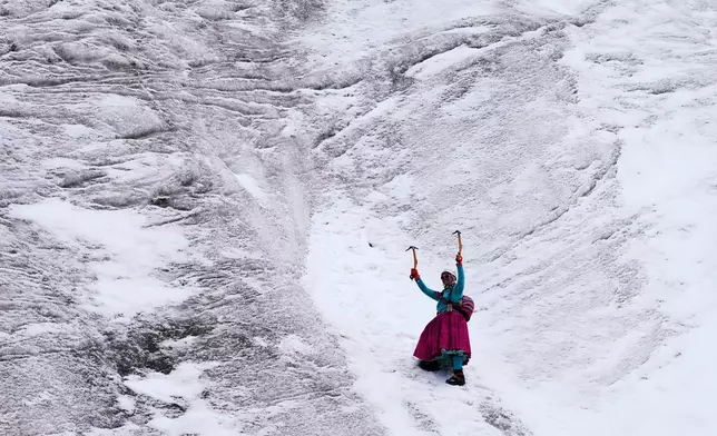 Mountain guide Ana Lia Gonzales climbs the Huayna Potosí glacier near El Alto, Bolivia, Monday, April 14, 2025. (AP Photo/Juan Karita)