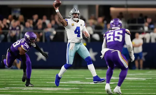 Dallas Cowboys quarterback Dak Prescott (4) throws a pass under pressure from Minnesota Vikings linebacker Jonathan Greenard, left, and linebacker Eric Wilson during the second half of an NFL football game Sunday, Dec. 14, 2025, in Arlington, Texas. (AP Photo/Tony Gutierrez)