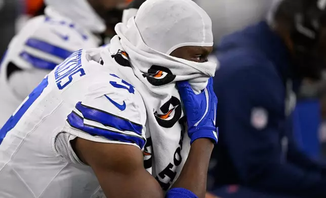 Dallas Cowboys wide receiver George Pickens looks on from the sidelines during the second half of an NFL football game against the Minnesota Vikings Sunday, Dec. 14, 2025, in Arlington, Texas. (AP Photo/Jerome Miron)