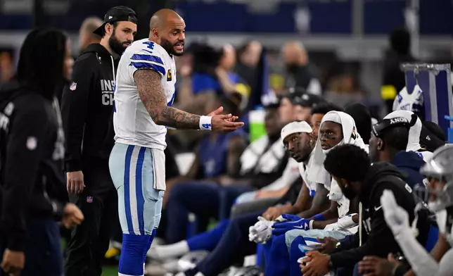 Dallas Cowboys quarterback Dak Prescott speaks to his teammates during the first half of an NFL football game against the Minnesota Vikings Sunday, Dec. 14, 2025, in Arlington, Texas. (AP Photo/Jerome Miron)