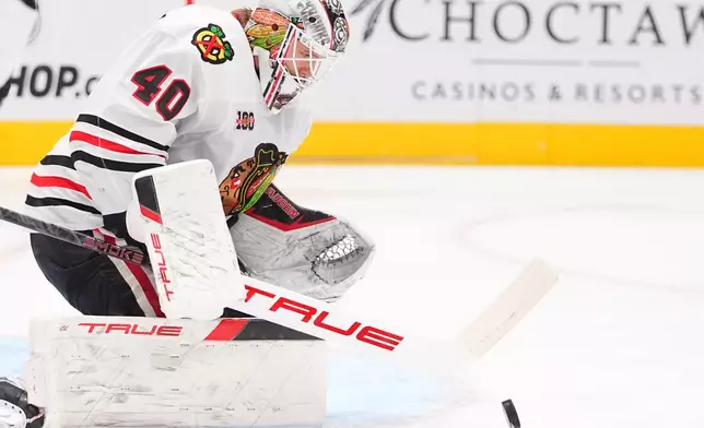 Chicago Blackhawks goaltender Arvid Soderblom defends the goal during the first period of an NHL hockey game against the Dallas Stars, Saturday, Dec. 27, 2025, in Dallas. (AP Photo/LM Otero)