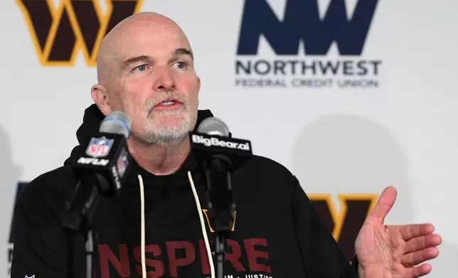 Washington Commanders head coach Dan Quinn talks to the media during a news conference following an NFL football game against the Philadelphia Eagles, Saturday, Dec. 20, 2025, in Landover, Md. (AP Photo/Nick Wass)