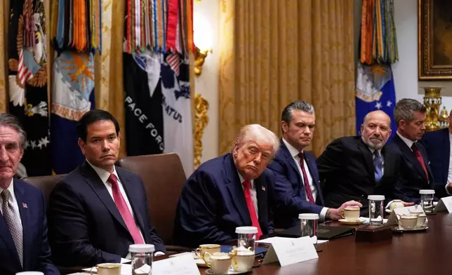 President Donald Trump listens during a Cabinet meeting at the White House, Tuesday, Dec. 2, 2025, in Washington. (AP Photo/Julia Demaree Nikhinson)