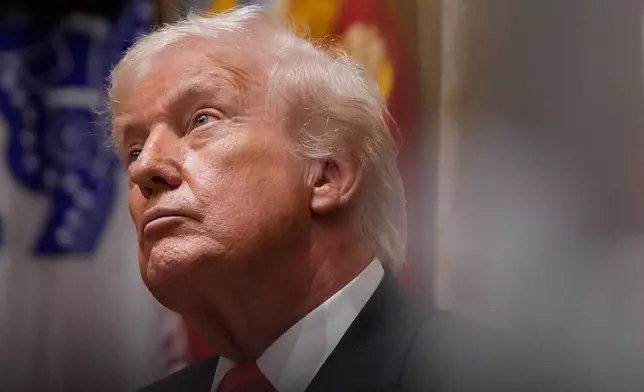 President Donald Trump listens during a Cabinet meeting at the White House, Tuesday, Dec. 2, 2025, in Washington. (AP Photo/Julia Demaree Nikhinson)