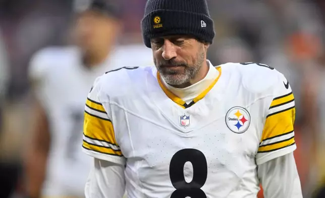 Pittsburgh Steelers quarterback Aaron Rodgers walks off the field after an NFL football game against the Cleveland Browns, Sunday, Dec. 28, 2025, in Cleveland. (AP Photo/David Richard)
