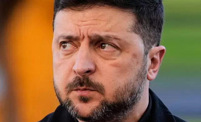 Ukraine's President Volodymyr Zelenskyy arrives at the Bellevue Palace for talks with German President Frank-Walter Steinmeier in Berlin, Germany, Monday, Dec. 15, 2025. (AP Photo/Markus Schreiber)