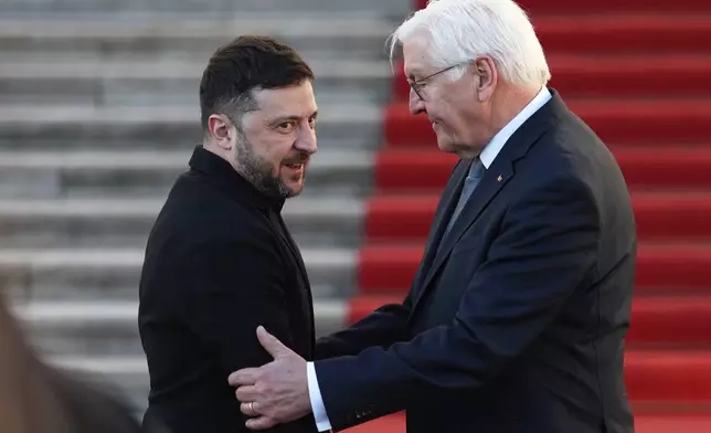 German President Frank-Walter Steinmeier welcomes Ukraine's President Volodymyr Zelenskyy at the Bellevue Palace in Berlin, Germany, Monday, Dec. 15, 2025. (AP Photo/Maryam Majd)
