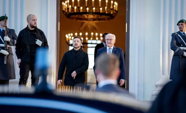 German President Frank-Walter Steinmeier, center right, and Volodymyr Zelenskyy, center left, President of Ukraine, leave the Bellevue Palace in Berlin, Germany, Monday, Dec. 15, 2025. (Kay Nietfeld/dpa/dpa via AP)