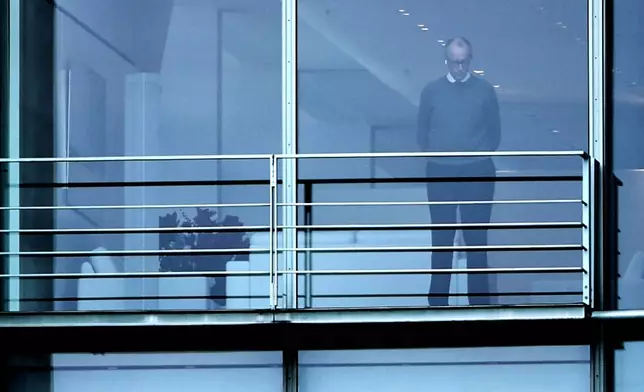 German Chancellor Friedrich Merz,stands in his office in the chancellory in Berlin, Germany, Sunday, Dec. 14, 2025. (AP Photo/Maryam Majd)
