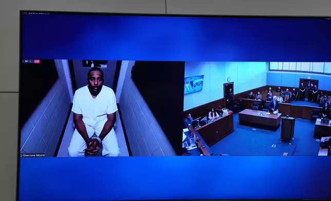 Michigan football coach Sherrone Moore appears via video in court on Friday, Dec. 12, 2025 in Ann Arbor, Mich. (AP Photo/ Ryan Sun)