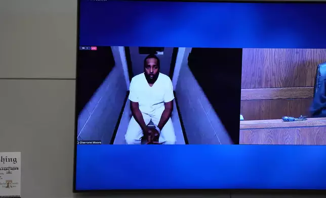 Michigan football coach Sherrone Moore appears via video in court on Friday, Dec. 12, 2025 in Ann Arbor, Mich. (AP Photo/ Ryan Sun)