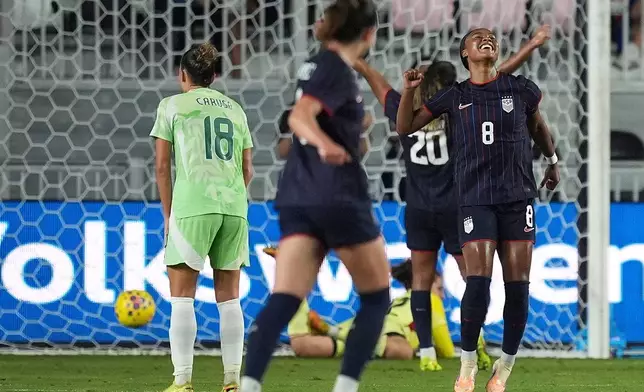 United States midfielder Jaedyn Shaw (8) celebrates after scoring her side's second goal against Italy during the first half of an international friendly soccer match, Monday, Dec. 1, 2025, in Fort Lauderdale, Fla. (AP Photo/Rebecca Blackwell)