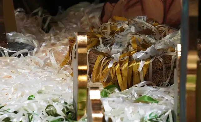 Ribbons representing lives saved from abortion according to Catholic organizations are seen on Nacimiento Gaudium, a nativity scene set in the Paul VI Hall during an audience led by Pope Leo XIV at the Vatican, Monday, Dec. 15, 2025. (AP Photo/Alessandra Tarantino)