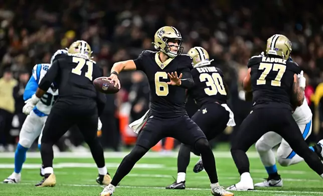 New Orleans Saints quarterback Tyler Shough (6) looks to pass in the second half of an NFL football game against the Carolina Panthers, Sunday, Dec. 14, 2025, in New Orleans. (AP Photo/Ella Hall)
