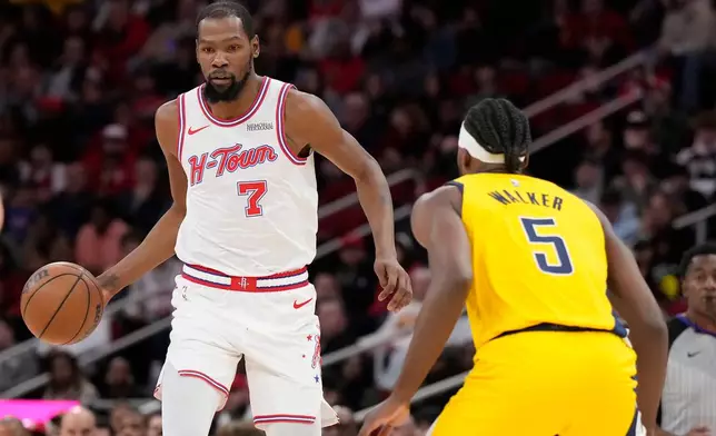 Houston Rockets forward Kevin Durant (7) controls the ball against Indiana Pacers forward Jarace Walker (5) during the first half of an NBA basketball game Monday, Dec. 29, 2025, in Houston. (AP Photo/Karen Warren)