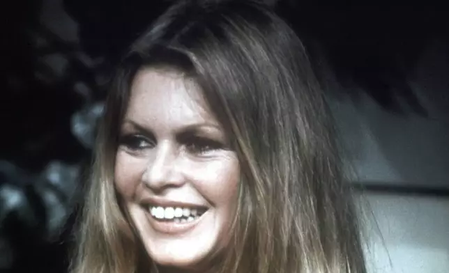 FILE - French actress Brigitte Bardot at a television studio in Paris, France, Oct. 1974, during the filming of a program "For You Madam". (AP Photo/File)