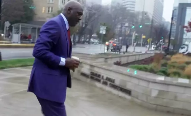 Michael Jordan arriving to federal courthouse to testify in NASCAR antitrust case on Friday, Dec. 5, 2025 in Charlotte, N.C. (AP Photo)