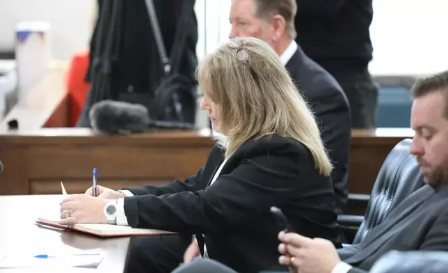 Former Colleton County Clerk of Court Mary Rebecca "Becky" Hill awaits a court hearing on Monday, Dec. 8, 2025, in St. Matthews, S.C. (AP Photo/Jeffrey Collins)