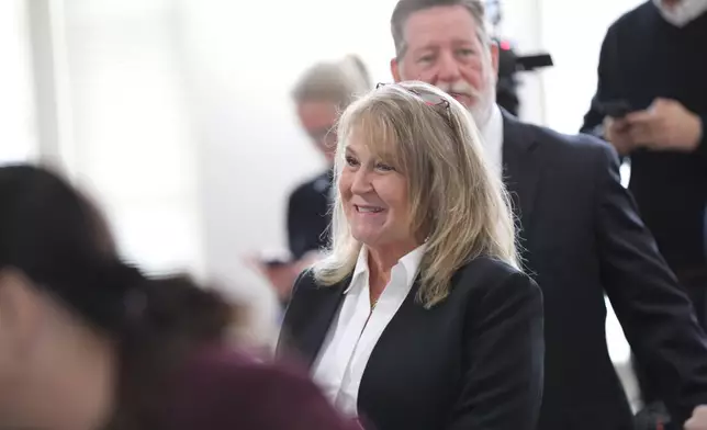 Former Colleton County Clerk of Court Mary Rebecca "Becky" Hill smiles after pleading guilty on Monday, Dec. 8, 2025, in St. Matthews, S.C.. (AP Photo/Jeffrey Collins)