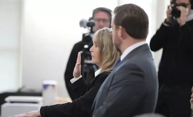 Former Colleton County Clerk of Court Mary Rebecca "Becky" Hill is sworn in during a court hearing on Monday, Dec. 8, 2025, in St. Matthews, S.C.. (AP Photo/Jeffrey Collins)