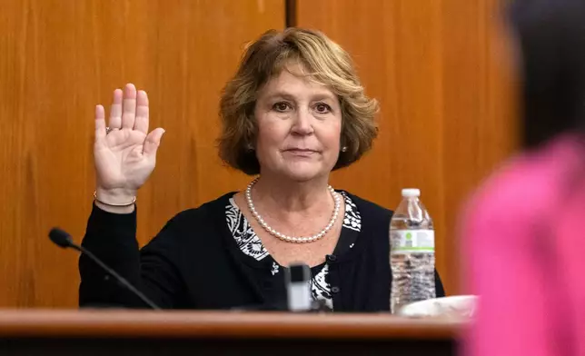 FILE- Colleton County Clerk of Court Rebecca Hill is sworn in before taking the stand to testify during the Alex Murdaugh jury-tampering hearing at the Richland County Judicial Center, Monday, Jan. 29, 2024, in Columbia, S.C. Hill, under investigation amid allegations of tampering with the jury in the Alex Murdaugh trial, announced her resignation on Monday, March 25, 2024. (Andrew J. Whitaker/The Post And Courier via AP, Pool, File)
