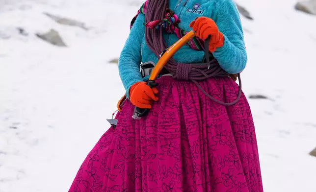 Mountain guide Ana Lia Gonzales poses for a photo on the Huayna Potosí glacier near El Alto, Bolivia, Monday, April 14, 2025. (AP Photo/Juan Karita)