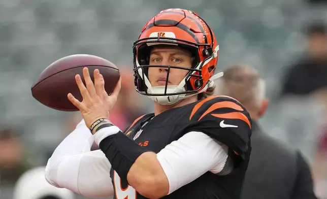 Cincinnati Bengals quarterback Joe Burrow warms up before an NFL football game against the Arizona Cardinals, Sunday, Dec. 28, 2025, in Cincinnati. (AP Photo/Jeff Dean)