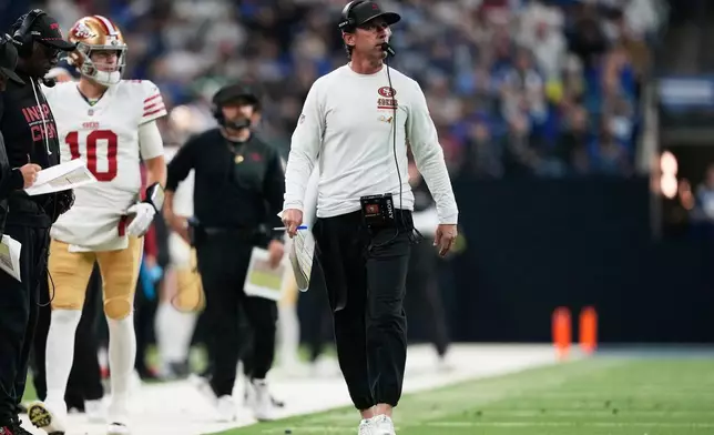 San Francisco 49ers head coach Kyle Shanahan walks near the sideline during the second half of an NFL football game against the Indianapolis Colts, Monday, Dec. 22, 2025, in Indianapolis. (AP Photo/Carolyn Kaster)
