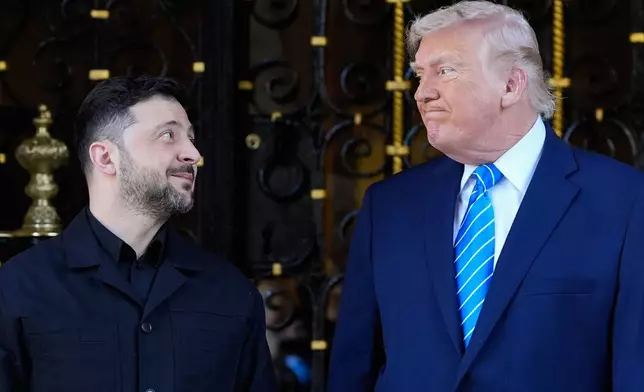 President Donald Trump greets Ukraine's President Volodymyr Zelenskyy at his Mar-a-Lago club, Sunday, Dec. 28, 2025, in Palm Beach, Fla. (AP Photo/Alex Brandon)