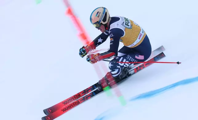 United States' River Radamus speeds down the course during an alpine ski, men's World Cup giant slalom, in Alta Badia, Italy, Sunday, Dec. 21,2025. (AP Photo/Alessandro Trovati)