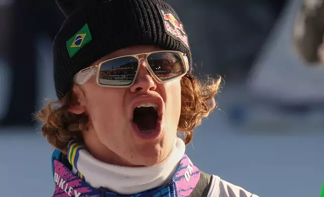 Brazil's Lucas Pinheiro Braathen celebrates at the finish area of an alpine ski, men's World Cup Giant slalom, in Alta Badia, Italy, Sunday Dec. 21, 2025. (AP Photo/Alessandro Trovati)