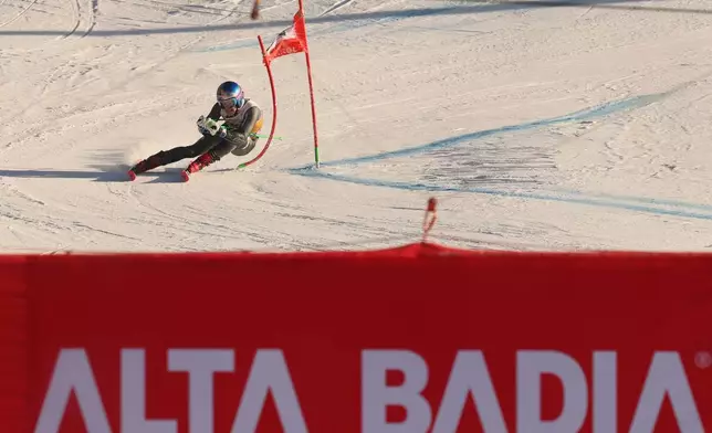 Brazil's Lucas Pinheiro Braathen speeds down the course towards the finish area of an alpine ski, men's World Cup Giant slalom, in Alta Badia, Italy, Sunday Dec. 21, 2025. (AP Photo/Alessandro Trovati)