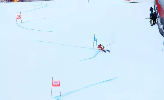 Switzerland's Marco Odermatt speeds down the course during an alpine ski, men's World Cup giant slalom, in Alta Badia, Italy, Sunday, Dec. 21,2025. (AP Photo/Alessandro Trovati)