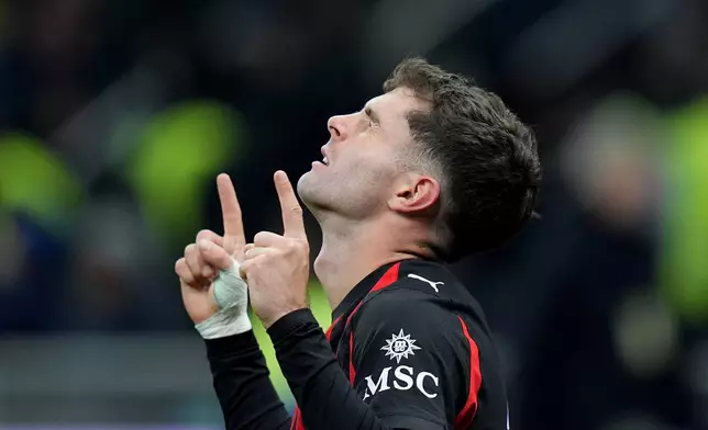 AC Milan's Christian Pulisic celebrates after scoring during the Serie A soccer match between Inter Milan and AC Milan in Milan, Italy, Sunday, Nov. 23, 2025. (Spada/LaPresse via AP)