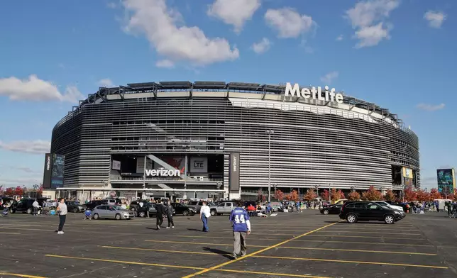 FILE - Tailgaters gather outside MetLife Stadium before an NFL football game between the New York Giants and the Philadelphia Eagles, Sunday, Nov. 6, 2016, in East Rutherford, N.J. (AP Photo/Frank Franklin II, File)