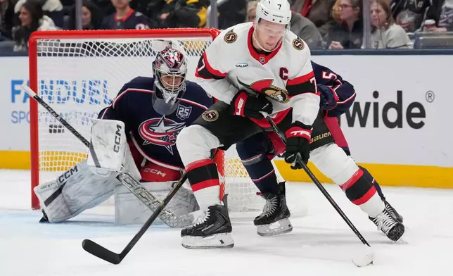 Ottawa Senators left wing Brady Tkachuk (7) skates in front of Columbus Blue Jackets goaltender Jet Greaves (73) int he second period of an NHL hockey game Thursday, Dec. 11, 2025, in Columbus, Ohio. (AP Photo/Sue Ogrocki)