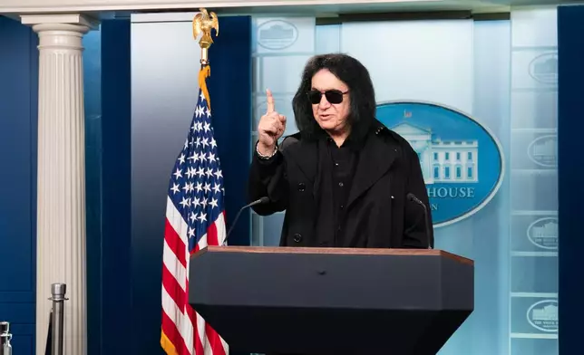 Kiss band member Gene Simmons speaks to members of the media at the White House, Friday, Dec. 5, 2025, in Washington. (AP Photo/Allison Robbert)
