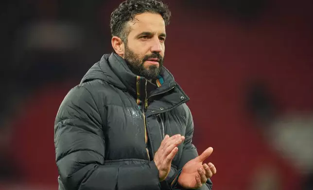 Manchester United's head coach Ruben Amorim walks on the pitch at the end of the English Premier League soccer match between Manchester United and West Ham United in Manchester, England, Thursday, Dec. 4, 2025. (AP Photo/Ian Hodgson)