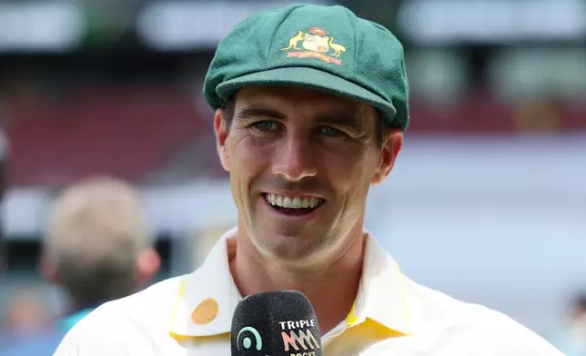 Australia's captain Pat Cummins speaks with media after Australia won the third Ashes cricket test against England in Adelaide, Australia, Sunday, Dec. 21, 2025. (AP Photo/James Elsby)