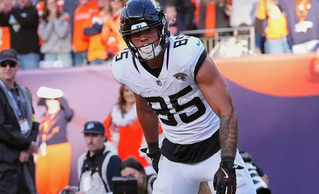 Jacksonville Jaguars tight end Brenton Strange (85) celebrates after scoring a touchdown against the Denver Broncos during the first half of an NFL football game in Denver, Sunday, Dec. 21, 2025. (AP Photo/David Zalubowski)