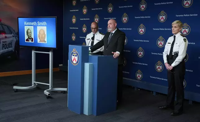 Detective Sergeant Steve Smith of the Cold Case Unit, center, Deputy Chief Rob Johnson, left, and Chief Superintendent Karen Gonneau of the Ontario Provincial Police provide a development in three historical homicide investigations, Thursday, Dec. 11, 2025, during a news conference at police headquarters in Toronto. (Chris Young/The Canadian Press via AP)