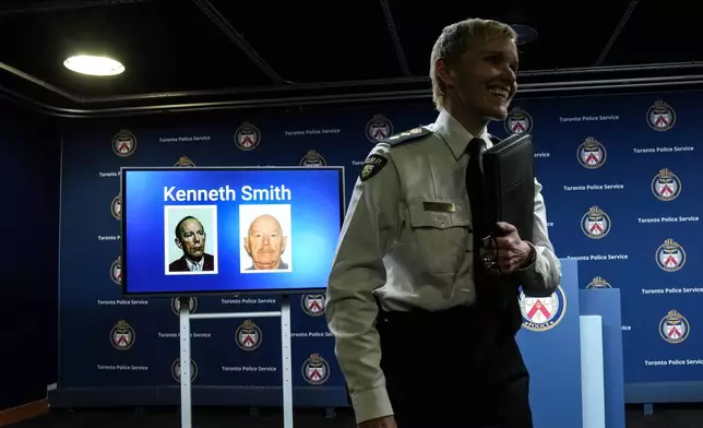 Chief Superintendent Karen Gonneau of the Ontario Provincial Police stands in front of a screen displaying images of Kenneth Smith as police provide a development in three historical homicide investigations, Thursday, Dec. 11, 2025, during a news conference at police headquarters in Toronto. (Chris Young/The Canadian Press via AP)