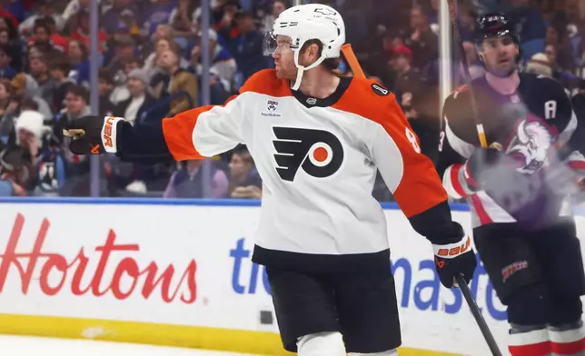 Philadelphia Flyers defenseman Cam York celebrates his goal during the second period of an NHL hockey game against the Buffalo Sabres, Thursday, Dec. 18, 2025, in Buffalo, N.Y. (AP Photo/Jeffrey T. Barnes)