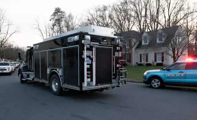 An FBI truck departs the street where the FBI made an arrest and are investigating a house in Woodbridge, Va., Thursday, Dec. 4, 2025. (AP Photo/Cliff Owen)