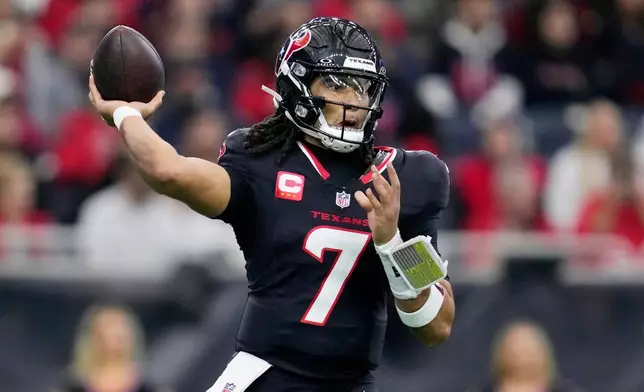 Houston Texans quarterback C.J. Stroud throws against the Arizona Cardinals during the first half of an NFL football game Sunday, Dec. 14, 2025, in Houston. (AP Photo/Ashley Landis)