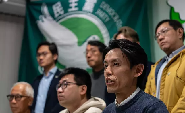 Lo Kin-hei, chairman of Hong Kong's Democratic Party, speaks at a press conference at the office of Hong Kong's Democratic Party in Hong Kong on Sunday, Dec. 14, 2025. (AP Photo/Chan Long Hei)